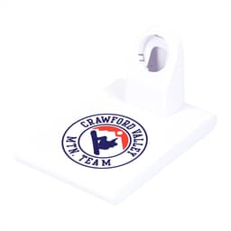 A white wireless charging pad with a holder for an iWatch and a logo printed on the surface.