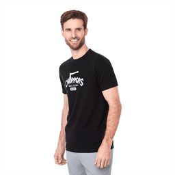A black short sleeve tee for men featuring a logo on the front. The model is smiling and wearing grey pants.
