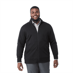 A man wearing a black eco fleece full zip jacket, smiling and standing against a white background.