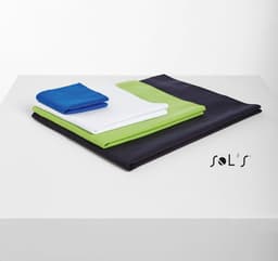 Four towels in varying sizes, featuring blue, white, green, and black colours, stacked on a surface.