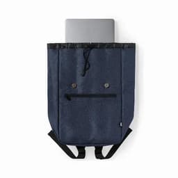 A navy blue backpack with a laptop compartment and adjustable straps, featuring a simple button design.