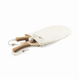 A wooden paddle and ball set with cork handles, enclosed in a beige fabric pouch.