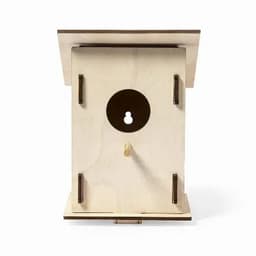 A wooden birdhouse in a natural finish, featuring a circular entrance and a flat roof. The design includes a keyhole mechanism.