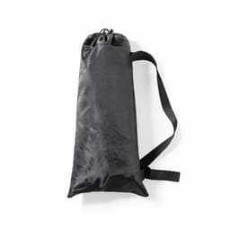A black drawstring bag with a strap, made from a lightweight material. It features a cinched top.