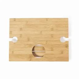 A bamboo cutting board with a smooth surface and rounded cutouts on each side. It has a circular hole in the centre.