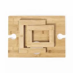 A wooden chopping board with three nested rectangular strips arranged in a pattern. It features round cut-out handles.