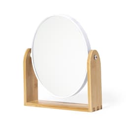 A circular mirror with a wooden stand in a natural bamboo finish, featuring a simple and modern design.
