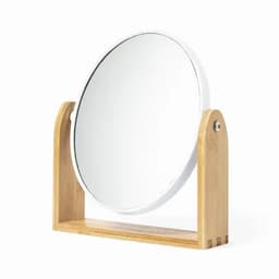 A round mirror with a wooden stand, featuring a sleek, minimalist design and natural bamboo base.