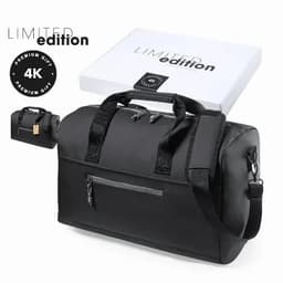 A black duffel bag with dual handles and a detachable shoulder strap, presented in a box with branding.