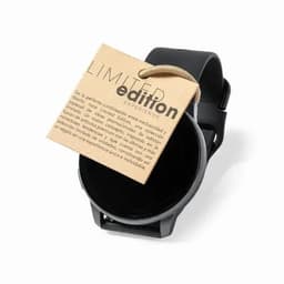 A black wristwatch with a round face, featuring a tag that indicates a limited edition.