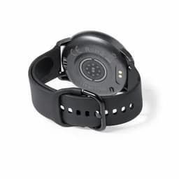 A fitness watch in black with a circular back featuring sensors and a strap with adjustment holes.
