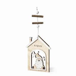 A wooden decorative ornament shaped like a house, featuring a Santa design in natural wood tones.