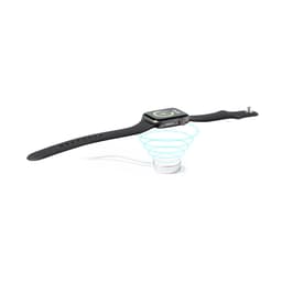 A smartwatch with a black strap rests on a circular charging base, surrounded by a light blue spiral.