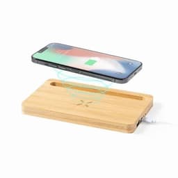 A wireless charging pad made of bamboo with a smartphone hovering above it, indicating charging functionality.