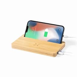 A wireless charger made from bamboo, featuring a sleek design with a smartphone placed on top for charging.