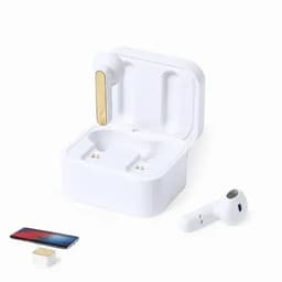 A pair of white wireless earbuds with a gold accent, resting in a white charging case alongside a small device.