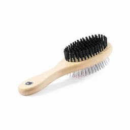 A hairbrush with a wooden handle and black bristles, featuring fine metal pins and a circular design.