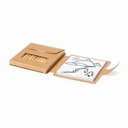 A set of coloured pencils in a brown cardboard box, with a drawing pad featuring black outline designs.