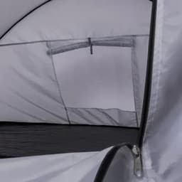 A tent interior featuring a white mesh window and a black floor, showcasing its spacious design.