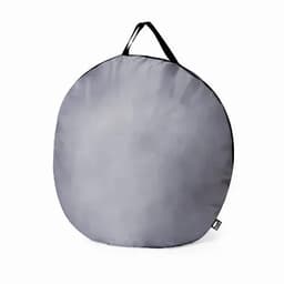 A round grey storage bag with a black handle, featuring a simple design and logo.
