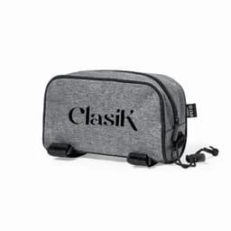 A grey toiletry bag with a zip closure and a logo. It features a compact design and sturdy straps.