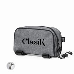 A grey toiletry bag with a zippered closure, featuring branding on the front and a clip attachment on the side.