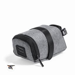 A grey storage pouch with a zip closure and strap, featuring a small logo and a compact design.