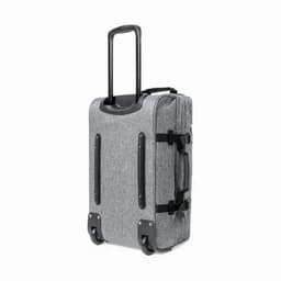 A grey wheeled travel bag with a retractable handle and side straps for additional support.