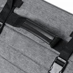 A grey promotional product featuring straps and a handle, with a textured fabric surface. It includes a logo.