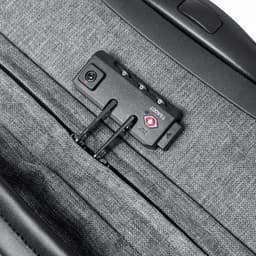 A grey suitcase with a zippered compartment and a black locking mechanism. It features a small logo on the lock.