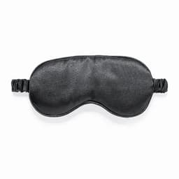 A black sleep mask with an elastic band for a comfortable fit. It has a smooth surface and a simple design.