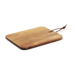 A wooden cutting board with a rounded edge and a leather tag. The board has a natural finish.