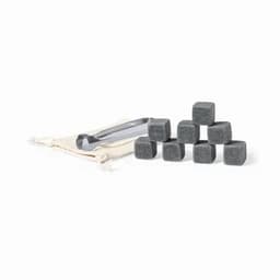 A set of eight black whiskey stones with a pair of tongs and a small pouch for storage.