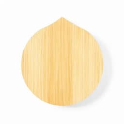 A round bamboo serving board with a natural finish and a pointed top. It features a smooth surface.