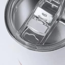 A drink bottle with a silver body and clear plastic lid, featuring an integrated straw and opening.