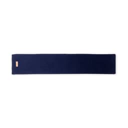 A floor mat in a deep navy blue, featuring a minimalist design with a small logo.