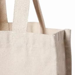 A beige tote bag with sturdy handles, showcasing a simple and minimalistic design.