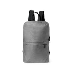 A grey backpack with adjustable black straps and a front zip pocket, featuring a simple design.