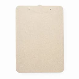 A clipboard in a natural beige colour with a smooth surface and two holes at the top for hanging.