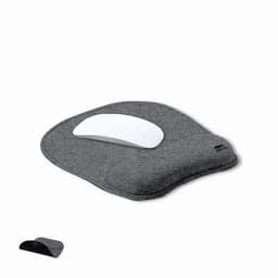 A wrist support with a grey fabric base and a white mouse pad section, featuring a brand logo.