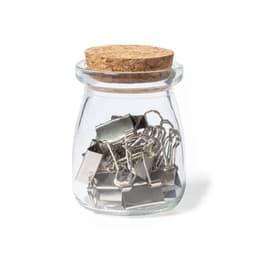 A glass jar with a cork lid containing several metal binder clips. The jar is clear and round.