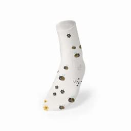 A cosy white sock with black and yellow bee designs, complemented by small flower patterns in various colours.