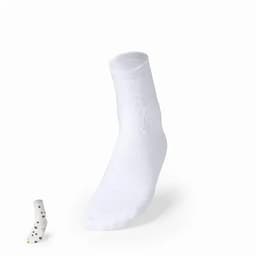 A pair of white socks with a single patterned sock displayed beside them. The patterned sock features black dots.