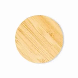 A round bamboo serving board in natural wood tones, featuring a smooth surface and a simple design.