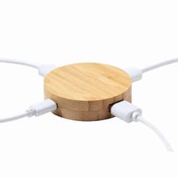 A bamboo charging station with multiple connected cables, featuring a round design and natural wood texture.