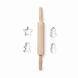 A wooden rolling pin with two handles, accompanied by metal cookie cutters in the shapes of a star, tree, and snowman.
