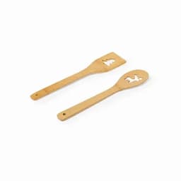 Two bamboo cooking utensils featuring festive cut-out shapes, a spatula and a spoon, both with long handles.