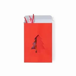 A red gift box with a cut-out Christmas tree design, decorated with colourful ribbons on top.