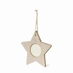 A star-shaped wooden decoration with a circular opening in the centre, featuring a hanging string.