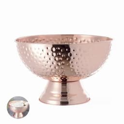 A copper bowl with a hammered finish on a pedestal base, showcasing a shiny, reflective surface.